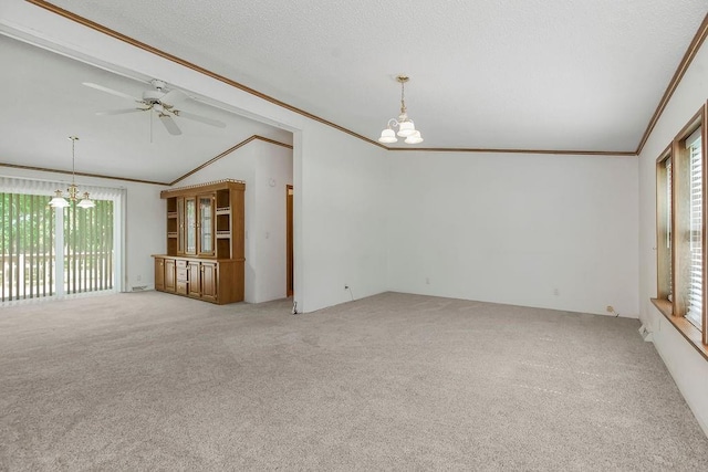 81 Enchanted Ln, Linn Valley, KS 66040 - spare room featuring a chandelier, crown molding, healthy amount of natural light, vaulted ceiling, and light carpet