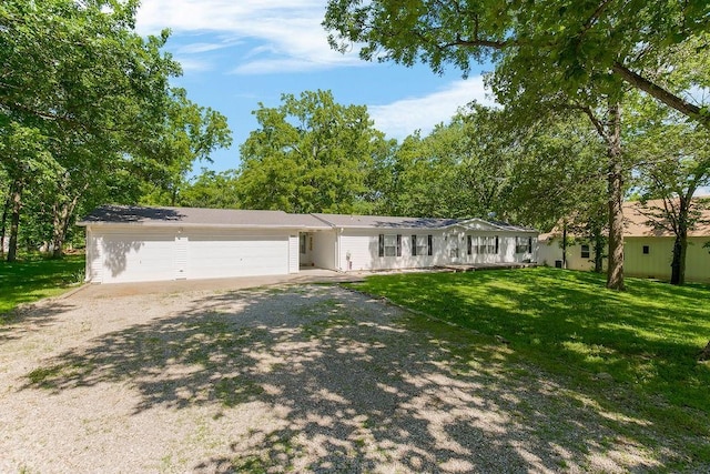 81 Enchanted Ln, Linn Valley, KS 66040 - ranch-style house with driveway, a garage, and a front lawn