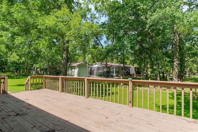 81 Enchanted Ln, Linn Valley, KS 66040 - deck featuring a lawn and view of wooded area