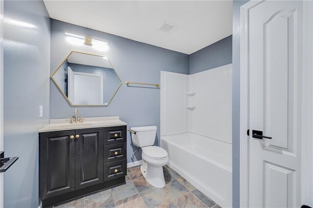7210 E 134th Ter, Grandview, MO 64030 - bathroom featuring vanity, stone finish flooring, and shower / bathtub combination