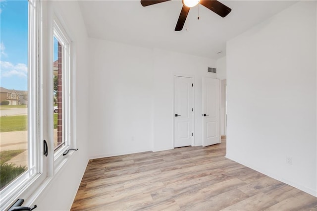 7210 E 134th Ter, Grandview, MO 64030 - empty room featuring ceiling fan and light wood-style flooring