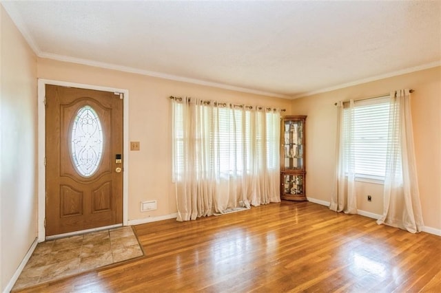 4234 E 68th St, Kansas City, MO 64132 - entrance foyer with wood finished floors and crown molding