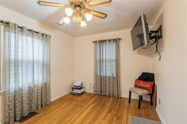 4234 E 68th St, Kansas City, MO 64132 - living area with light wood-type flooring and ceiling fan