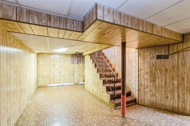 4234 E 68th St, Kansas City, MO 64132 - finished basement featuring wood walls and stairs