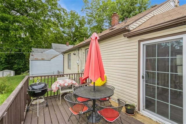 4234 E 68th St, Kansas City, MO 64132 - wooden deck with a storage unit