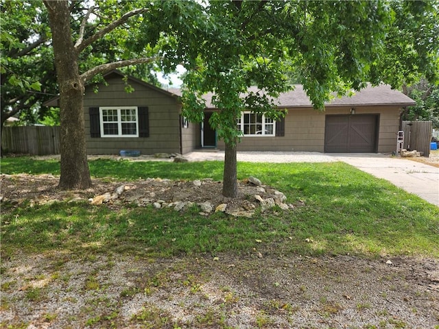 3 N 12th St, Louisburg, KS 66053 - ranch-style house featuring concrete driveway and an attached garage