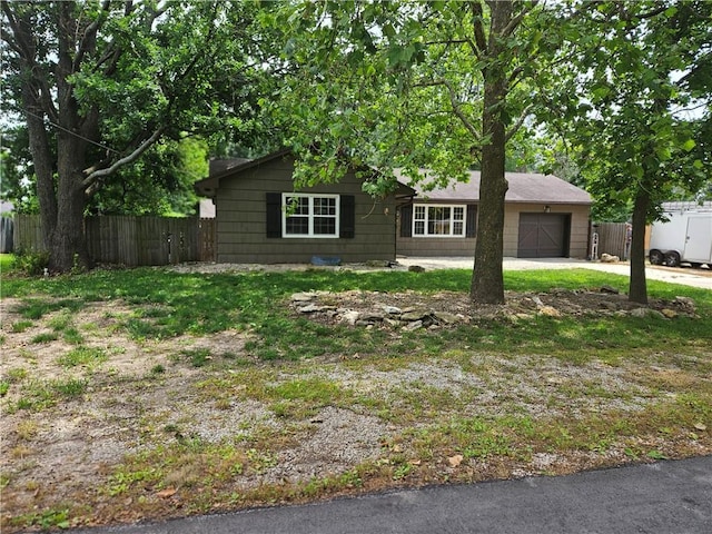 3 N 12th St, Louisburg, KS 66053 - view of front facade featuring an attached garage and concrete driveway