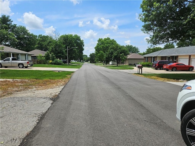 3 N 12th St, Louisburg, KS 66053 - view of asphalt street featuring street lights and a residential view