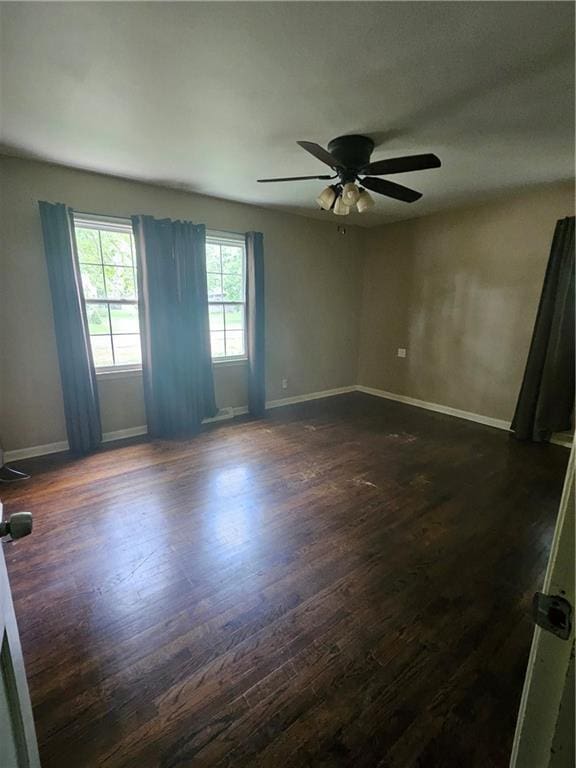 3 N 12th St, Louisburg, KS 66053 - unfurnished room featuring dark wood-style floors and ceiling fan