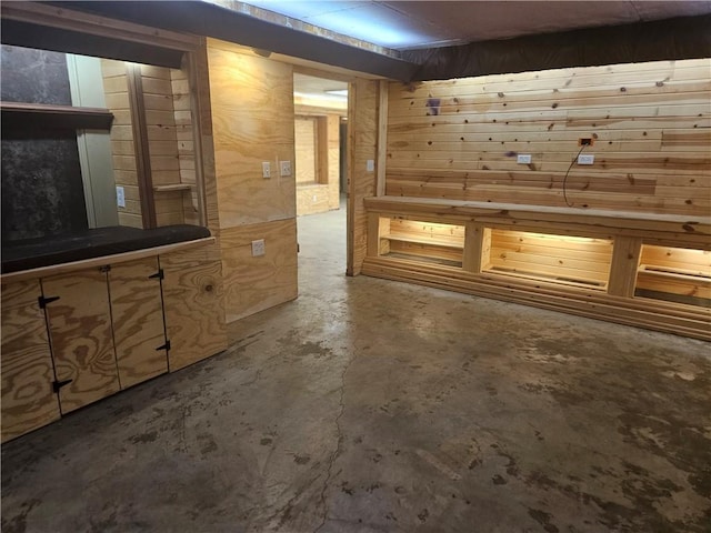 3 N 12th St, Louisburg, KS 66053 - interior space featuring concrete floors, wooden walls, and a high end fireplace