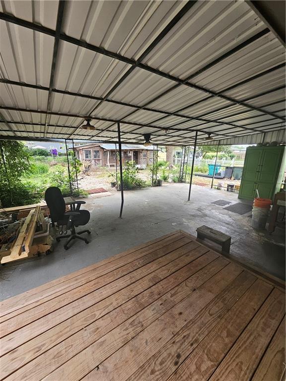 3 N 12th St, Louisburg, KS 66053 - wooden terrace with a patio