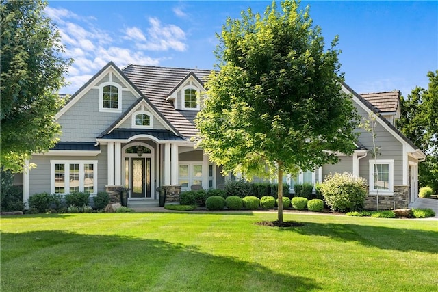 4915 NW Canyon Ct, Lees Summit, MO 64064 - view of front of home with stone siding and a front lawn