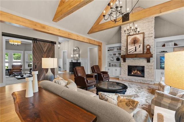 4915 NW Canyon Ct, Lees Summit, MO 64064 - living room featuring a fireplace, a chandelier, wood finished floors, beam ceiling, and wainscoting