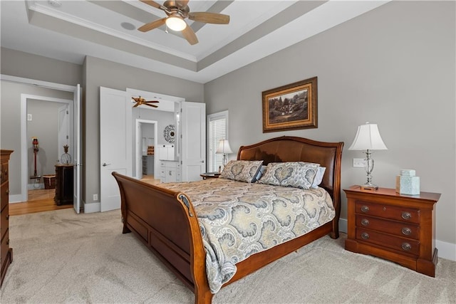 4915 NW Canyon Ct, Lees Summit, MO 64064 - bedroom with light colored carpet, crown molding, a tray ceiling, and a ceiling fan