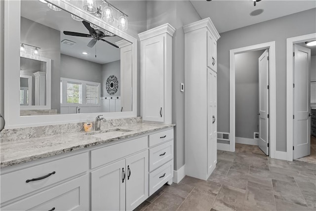 4915 NW Canyon Ct, Lees Summit, MO 64064 - full bath featuring a ceiling fan, vanity, and a closet