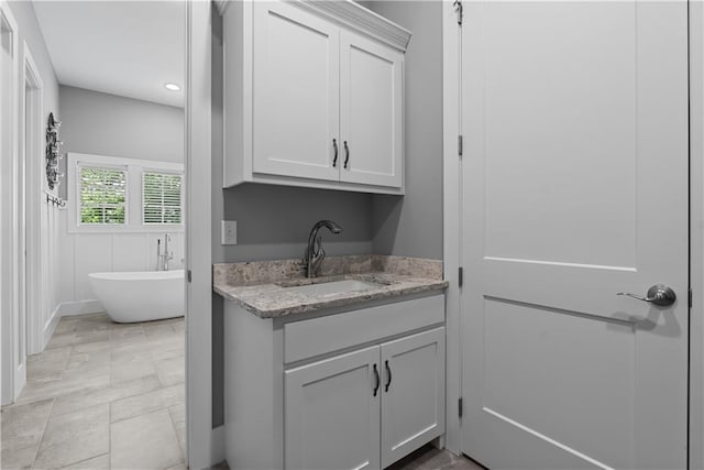 4915 NW Canyon Ct, Lees Summit, MO 64064 - washroom featuring a sink and recessed lighting