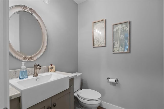 4915 NW Canyon Ct, Lees Summit, MO 64064 - half bathroom featuring vanity and toilet