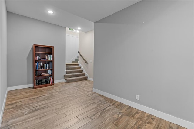 4915 NW Canyon Ct, Lees Summit, MO 64064 - finished below grade area with wood finished floors, stairs, and recessed lighting