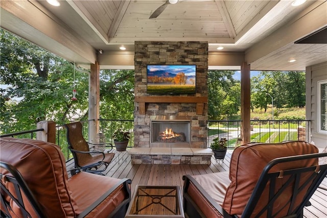 4915 NW Canyon Ct, Lees Summit, MO 64064 - wooden terrace with an outdoor stone fireplace, a grill, and a ceiling fan