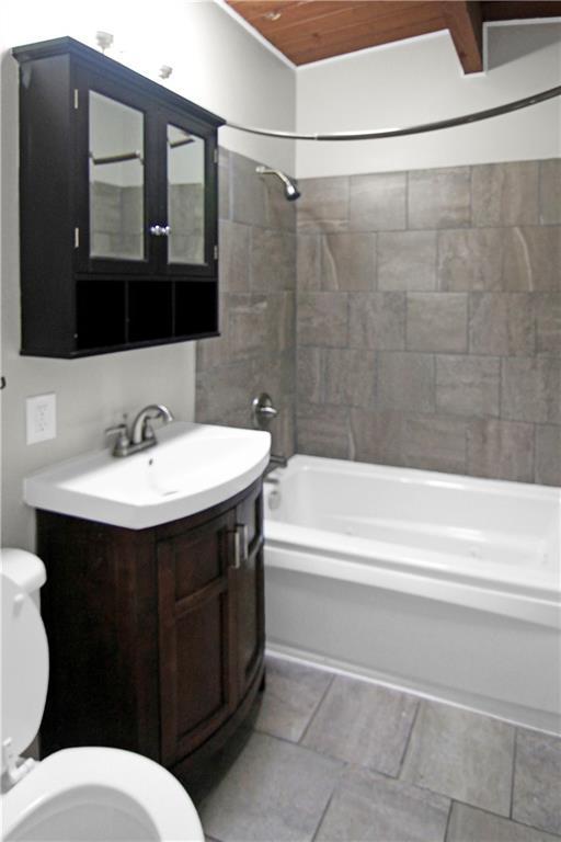 12507 E 46th Ter S, Independence, MO 64055 - bathroom featuring shower / tub combination, vanity, and wooden ceiling