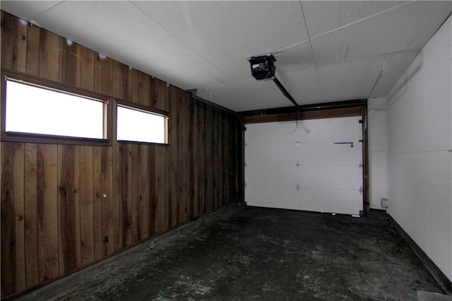 12507 E 46th Ter S, Independence, MO 64055 - garage featuring a garage door opener and wooden walls