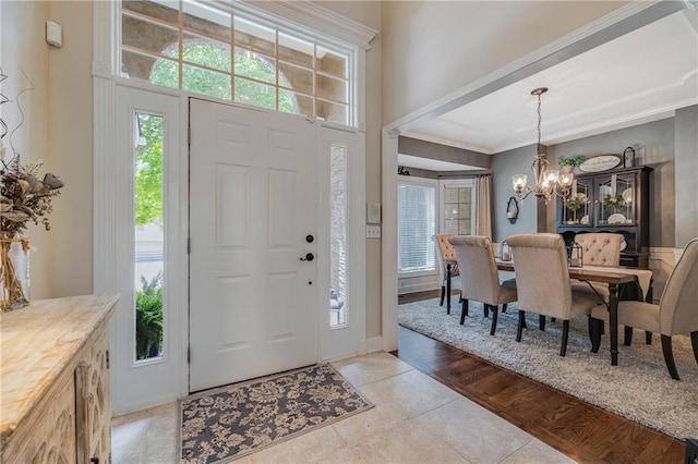 1617 Summit Valley Ln, Lees Summit, MO 64081 - entryway with a chandelier, light tile patterned floors, plenty of natural light, and crown molding