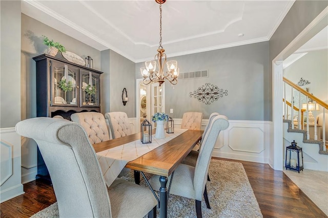 1617 Summit Valley Ln, Lees Summit, MO 64081 - dining area with stairs, a chandelier, a tray ceiling, wood finished floors, and wainscoting