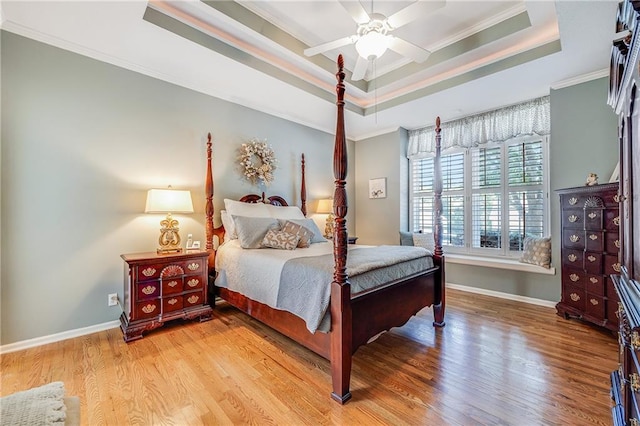 1617 Summit Valley Ln, Lees Summit, MO 64081 - bedroom with a raised ceiling, wood finished floors, ornamental molding, and a ceiling fan