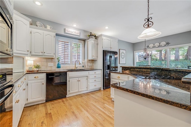 1617 Summit Valley Ln, Lees Summit, MO 64081 - kitchen with black appliances, white cabinetry, light wood-style flooring, and recessed lighting