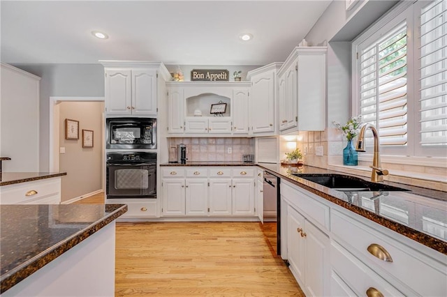 1617 Summit Valley Ln, Lees Summit, MO 64081 - kitchen featuring black appliances, white cabinetry, dark stone counters, light wood finished floors, and recessed lighting