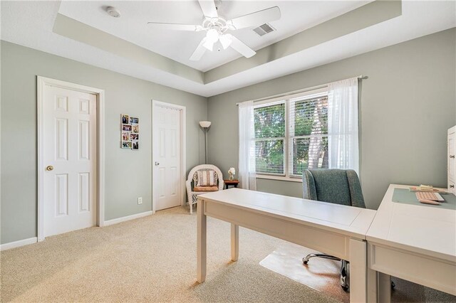 1617 Summit Valley Ln, Lees Summit, MO 64081 - office with light carpet, a tray ceiling, and a ceiling fan