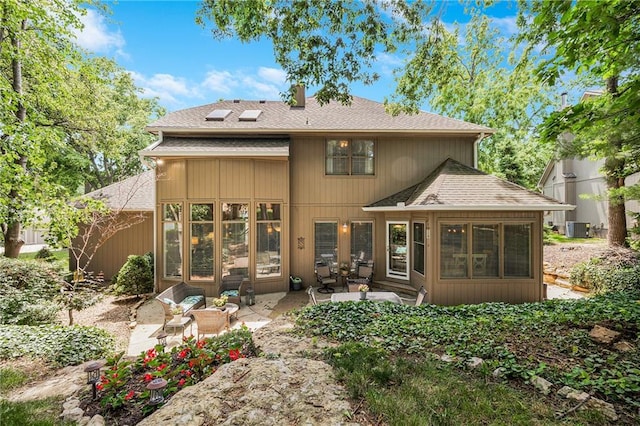 1617 Summit Valley Ln, Lees Summit, MO 64081 - back of property featuring a shingled roof, a patio area, and a sunroom