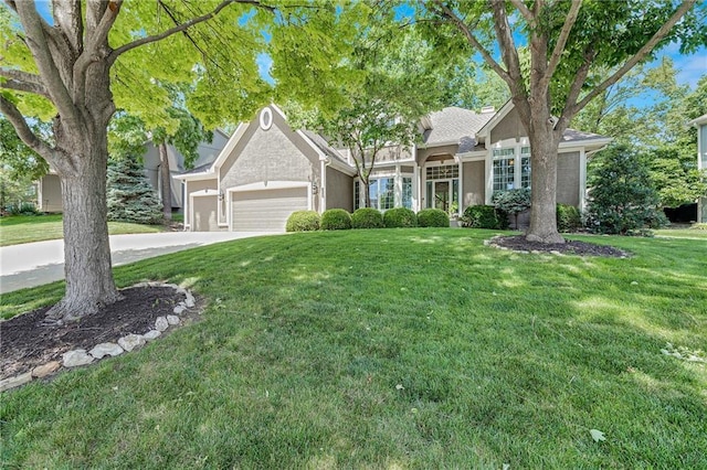 1617 Summit Valley Ln, Lees Summit, MO 64081 - view of front of home featuring a front lawn, a garage, stucco siding, and concrete driveway