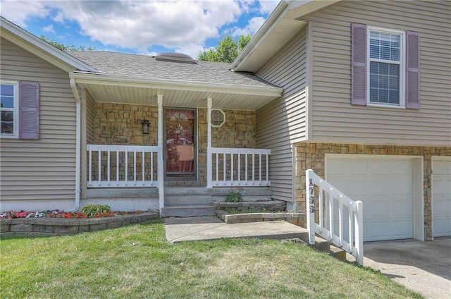 1733 NE Ridgeview Dr, Lees Summit, MO 64086 - doorway to property with stone siding, an attached garage, covered porch, and a lawn