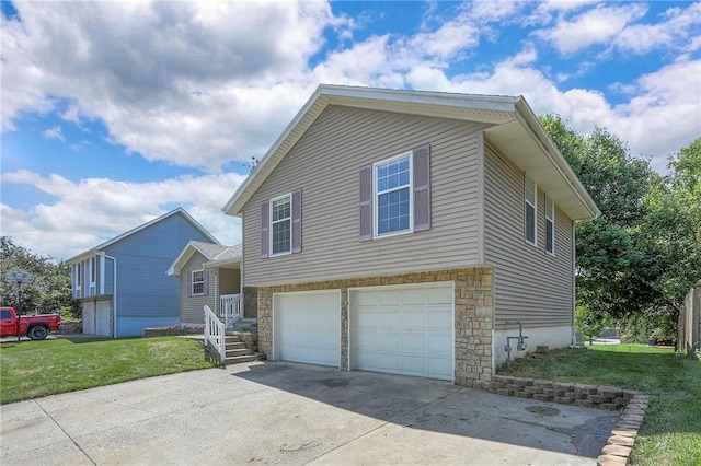 1733 NE Ridgeview Dr, Lees Summit, MO 64086 - view of front of property featuring concrete driveway, a garage, a front lawn, and stone siding