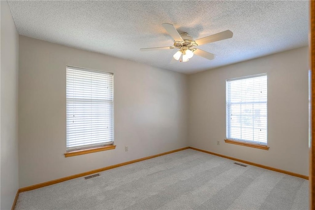 1733 NE Ridgeview Dr, Lees Summit, MO 64086 - unfurnished room featuring carpet floors, ceiling fan, and a textured ceiling