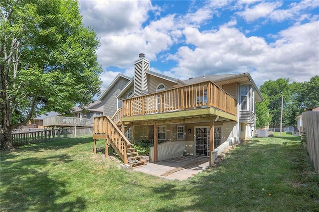 1733 NE Ridgeview Dr, Lees Summit, MO 64086 - rear view of house featuring a wooden deck, a fenced backyard, stairs, a chimney, and a patio area