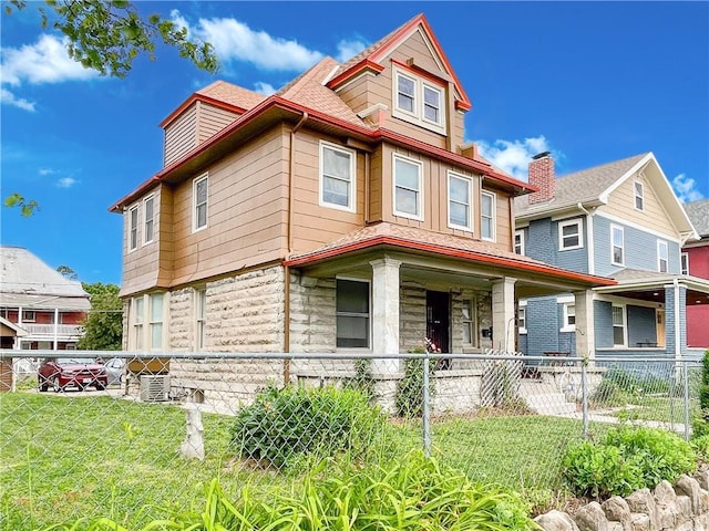 330 Wabash Ave, Kansas City, MO 64124 - victorian-style house with covered porch and stone siding