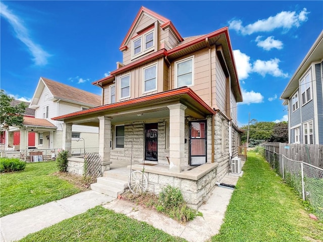 330 Wabash Ave, Kansas City, MO 64124 - view of front of property featuring stone siding and covered porch
