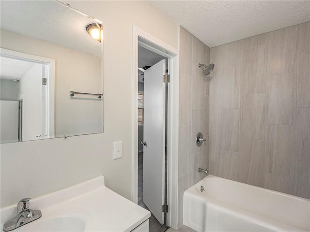 330 Wabash Ave, Kansas City, MO 64124 - bathroom with shower / bath combination, vanity, and a textured ceiling