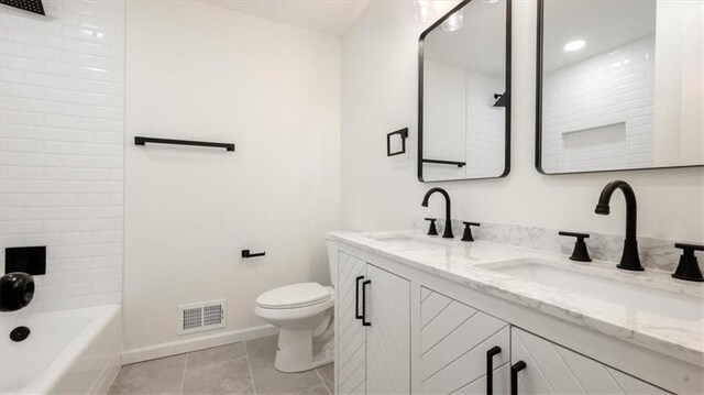 11400 E 62nd Ter, Raytown, MO 64133 - full bathroom featuring double vanity, tile patterned floors, and shower / bath combination