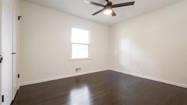 11400 E 62nd Ter, Raytown, MO 64133 - spare room featuring dark wood-style floors and ceiling fan