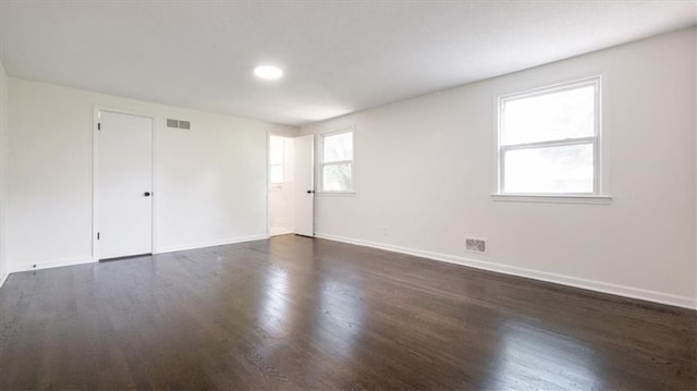 11400 E 62nd Ter, Raytown, MO 64133 - spare room featuring dark wood-style flooring