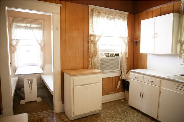 210 S Mulberry St, Paola, KS 66071 - kitchen with light countertops, white cabinets, and cooling unit