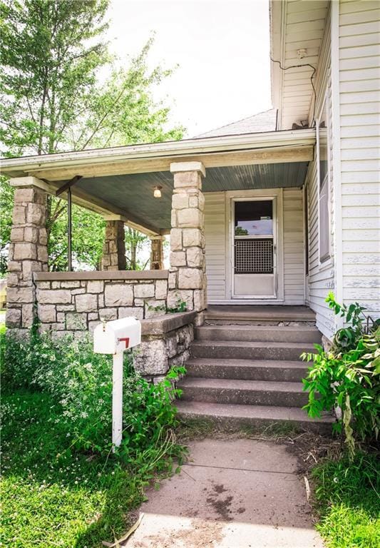 210 S Mulberry St, Paola, KS 66071 - entrance to property with covered porch