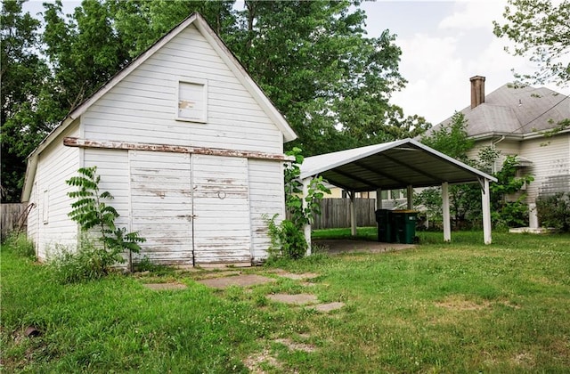 210 S Mulberry St, Paola, KS 66071 - view of yard featuring a detached carport