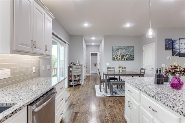8604 NE 103rd St, Kansas City, MO 64157 - kitchen featuring stainless steel dishwasher, dark wood-style floors, tasteful backsplash, white cabinets, and light stone countertops