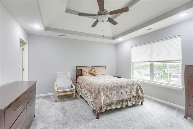 8604 NE 103rd St, Kansas City, MO 64157 - bedroom with a tray ceiling, light carpet, recessed lighting, and ceiling fan