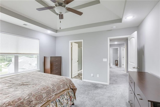 8604 NE 103rd St, Kansas City, MO 64157 - bedroom featuring a tray ceiling, light carpet, recessed lighting, ensuite bath, and a ceiling fan