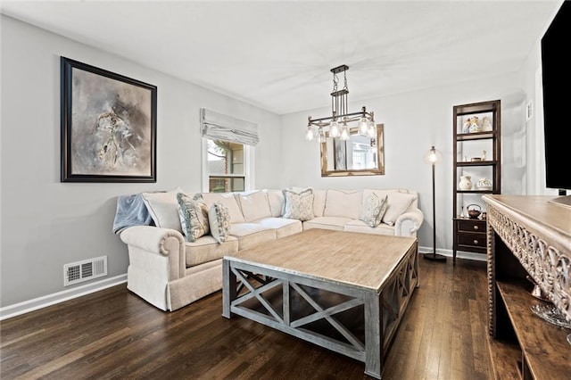 101 W 116th St, Kansas City, MO 64114 - living area with dark wood-style floors and a chandelier